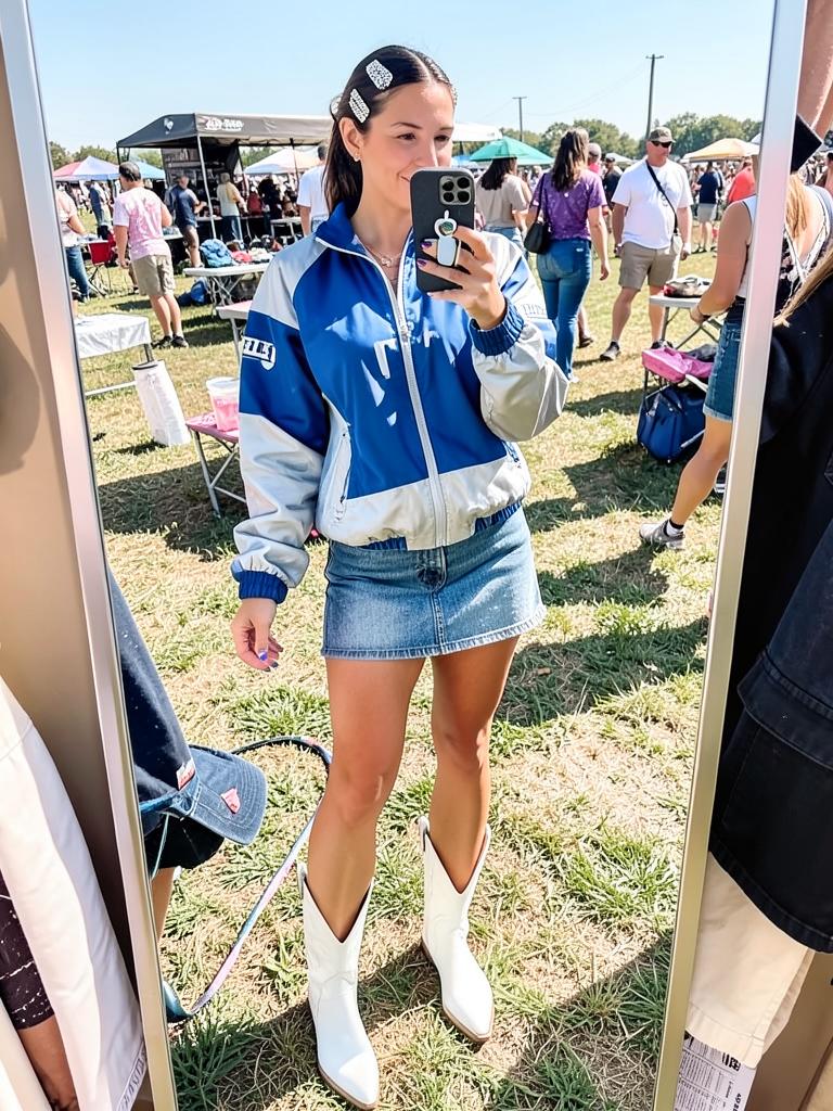 Windbreaker, denim mini, white cowboy boots. Tailgate fit check: passed.